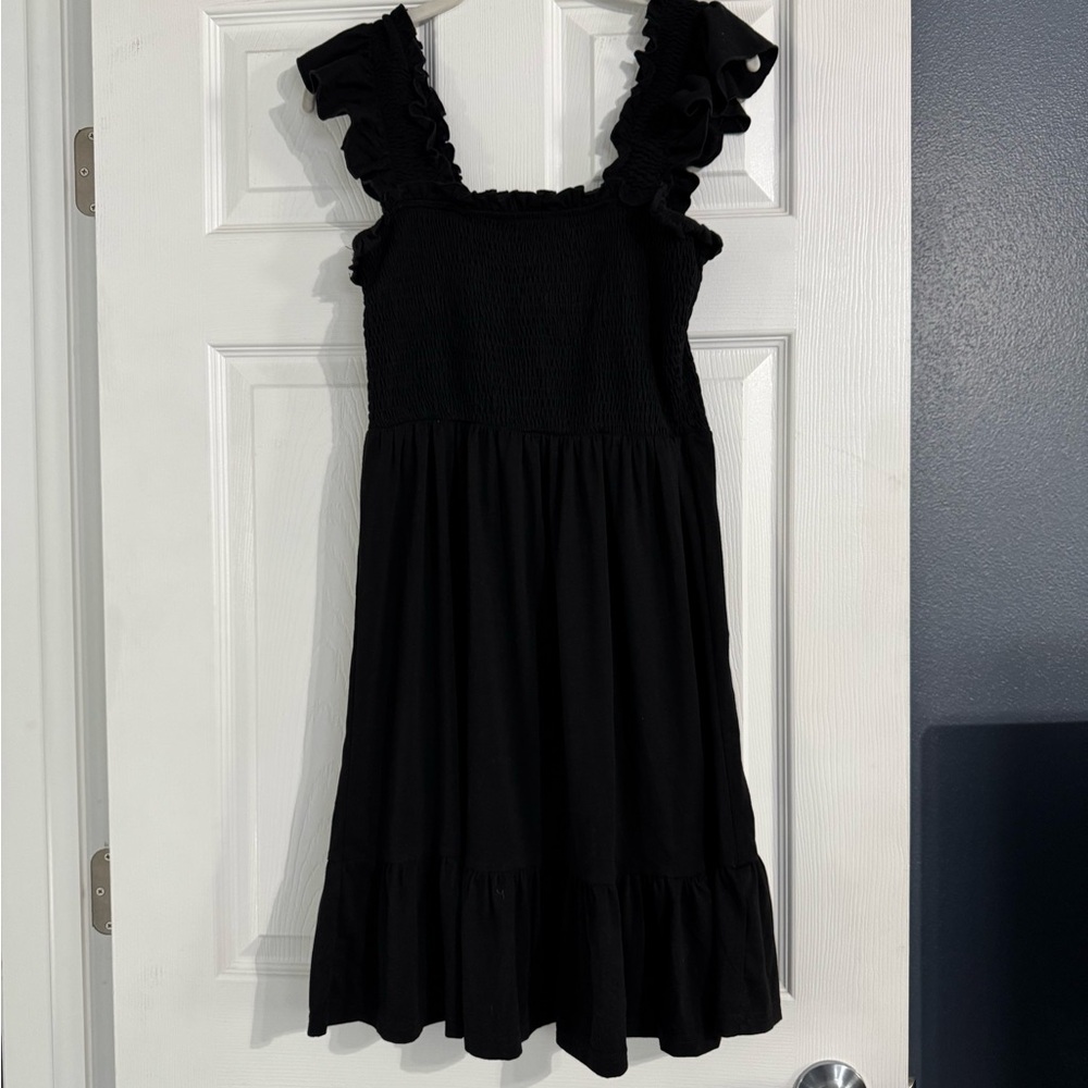 Women’s black dress with ruffle sleeves